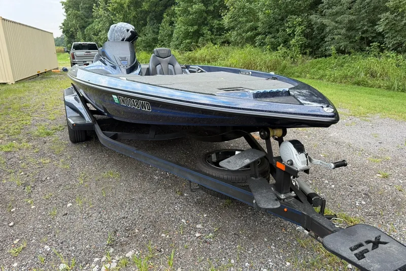 Slide: The Image of 2018 Skeeter FX20 Limited Edition boat on trailer, parked outdoors. - 6