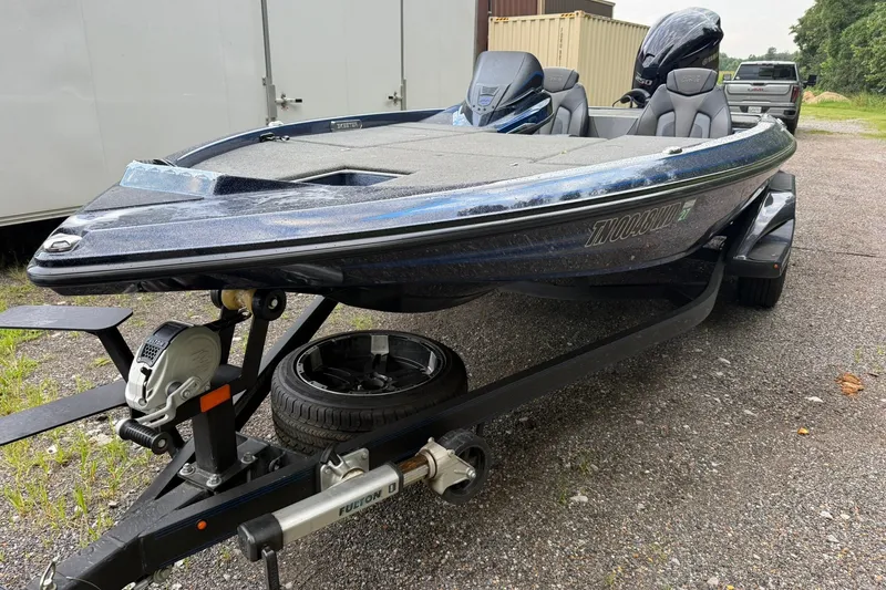 Slide: The Image of 2018 Skeeter FX20 Limited Edition boat on trailer, parked outdoors. - 7