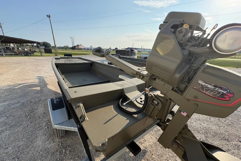 Slide: The Image of 2026 Gator Tail 1748 GATOR boat with XD3 engine, parked on gravel. - 4
