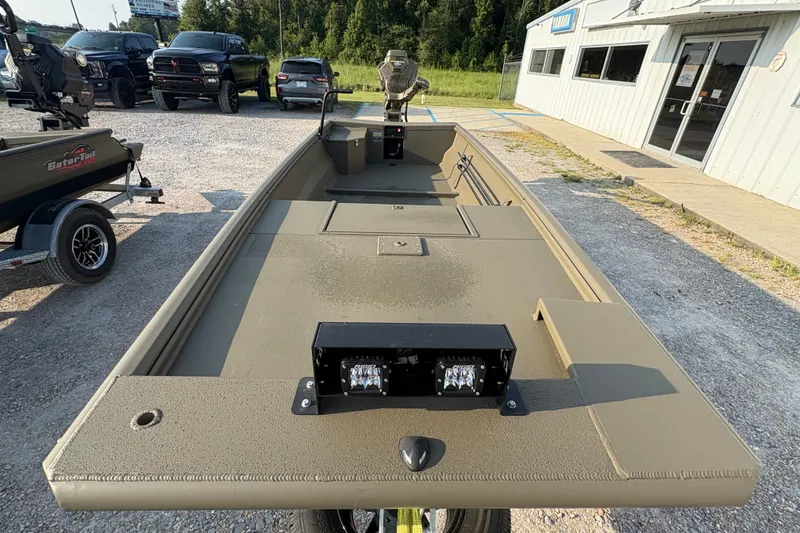 Slide: The Image of 2026 Gator Tail 1748 GATOR boat on display outside dealership. - 6