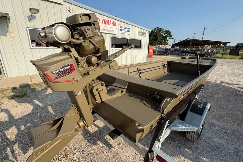 Slide: The Image of 2026 Gator Tail 1748 GATOR boat with XD3 motor on trailer, outdoor setting. - 3