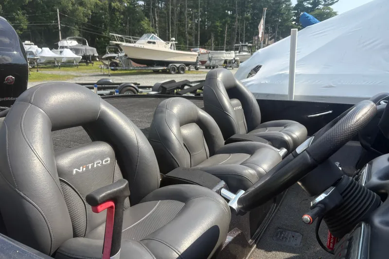 Slide: The Image of Interior of a 2015 Nitro Z-8 DC boat with sleek black leather seats. - 7