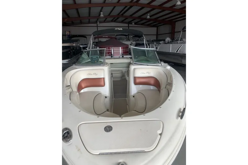 Slide: The Image of 2006 Sea Ray 220 Select boat interior with seating, stored indoors. - 6