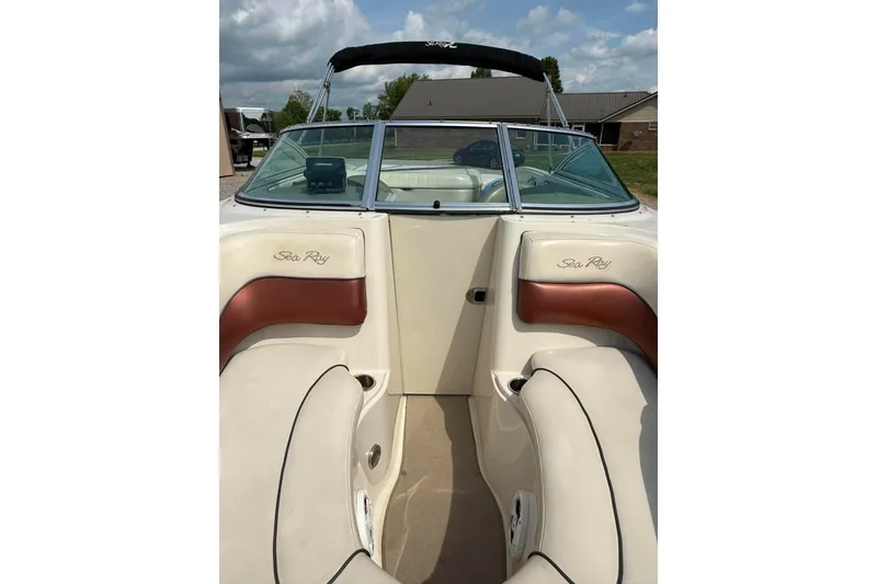 Slide: The Image of 2006 Sea Ray 220 Select boat interior with beige and brown seating. - 12