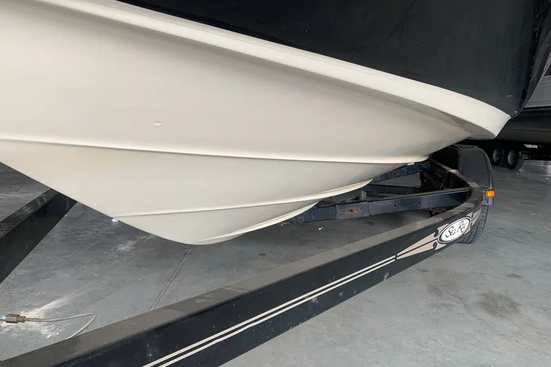 Slide: The Image of 2006 Sea Ray 220 Select boat hull on trailer in storage facility. - 17