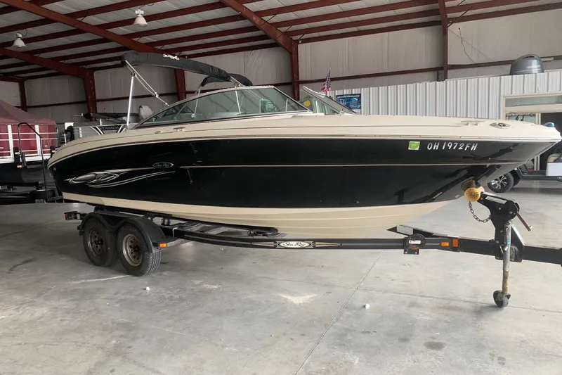 Slide: The Image of 2006 Sea Ray 220 Select boat on trailer in indoor storage facility. - 1