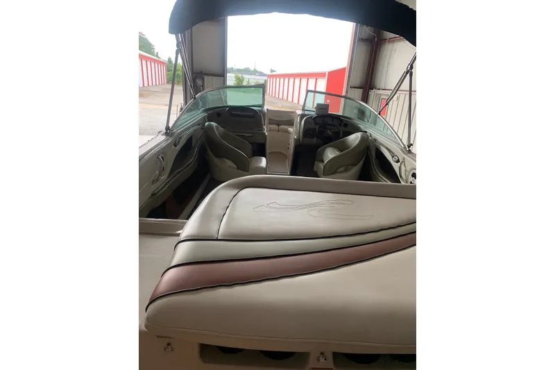Slide: The Image of Interior view of a 2006 Sea Ray 220 Select boat with seating and dashboard. - 7