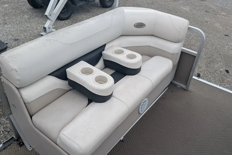 Slide: The Image of 2005 Sylvan 8520 Mirage Cruise RE boat seating with cup holders on deck. - 4