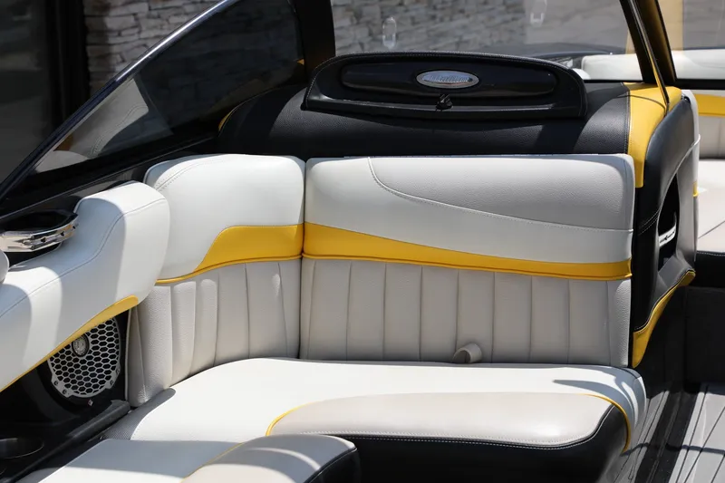 Slide: The Image of 2014 Malibu Wakesetter 22 MXZ interior with white and yellow seating. - 6