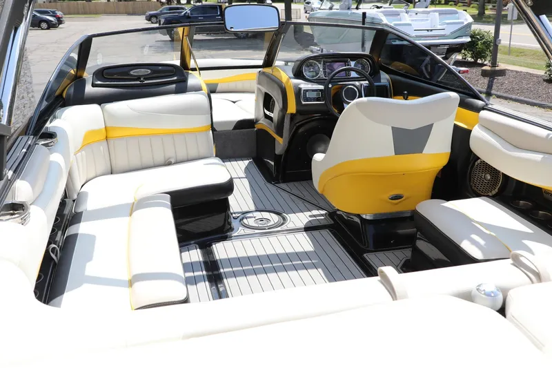 Slide: The Image of Interior of a 2014 Malibu Wakesetter 22 MXZ boat with stylish seating and dashboard. - 1