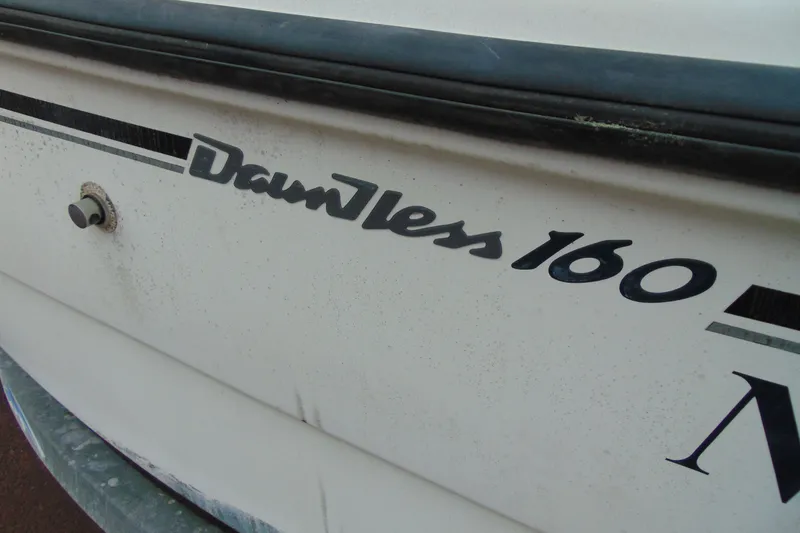 Slide: The Image of Close-up of 2002 Boston Whaler 160 Dauntless boat nameplate. - 4