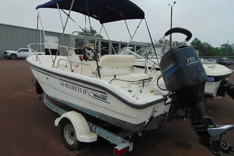 Slide: The Image of 2002 Boston Whaler 160 Dauntless boat with Mercury engine on trailer. - 3