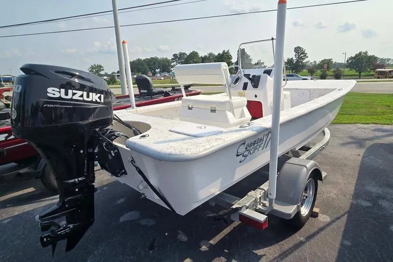 Slide: The Image of 2027 Coastal Skiff 171 boat with Suzuki outboard motor on trailer. - 3