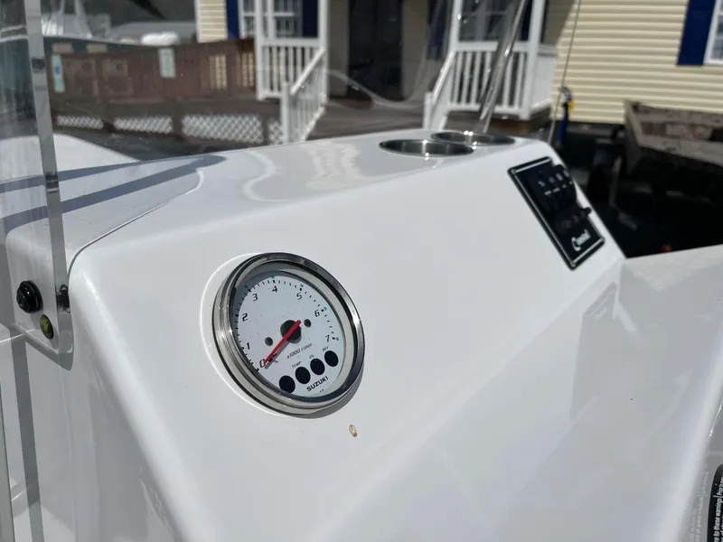 Slide: The Image of 2025 Coastal Skiff 171 dashboard with gauge and control panel. - 8