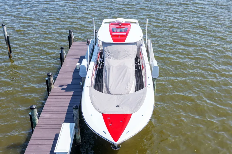 Slide: The Image of Aerial view of a 2016 MTI V42 boat docked on calm water. - 6