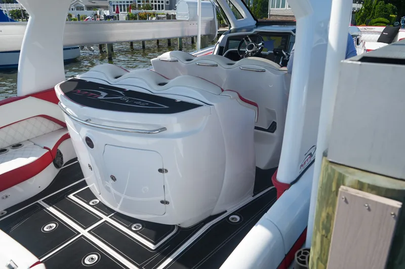 Slide: The Image of Luxury MTI V42 boat interior with sleek white and red seating, 2016 model. - 14