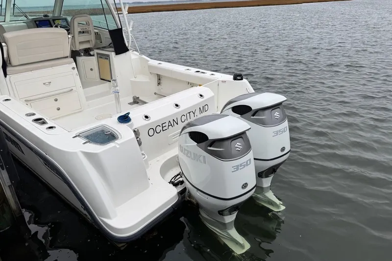 Slide: The Image of 2016 Boston Whaler 315 Conquest boat with dual Suzuki 350 engines, docked in Ocean City, MD. - 3