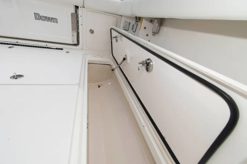 Slide: The Image of 2016 Boston Whaler 315 Conquest storage compartment detail, showcasing sleek design and functionality. - 30