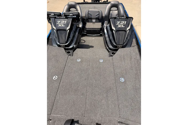 Slide: The Image of 2024 TRACKER NITRO Z21XL boat interior with dual seats and spacious deck. - 15