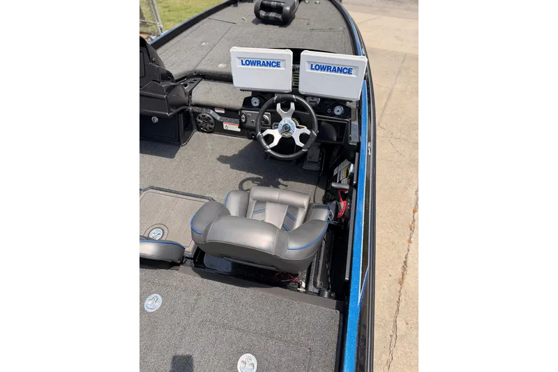 Slide: The Image of 2024 TRACKER NITRO Z21XL boat interior with Lowrance electronics and steering wheel. - 10
