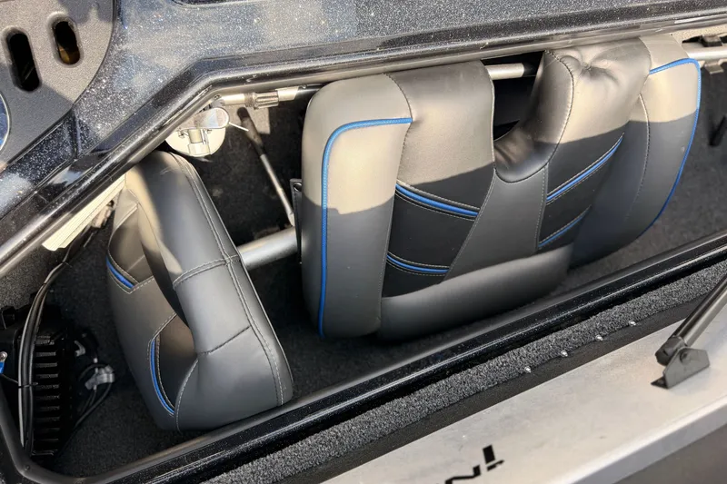 Slide: The Image of 2024 TRACKER NITRO Z21XL boat interior with gray and blue cushioned seats. - 19