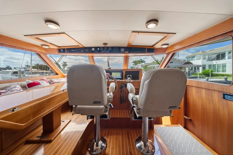 Slide: The Image of Interior of 2011 Marlow Explorer 70E yacht with helm and seating area. - 18