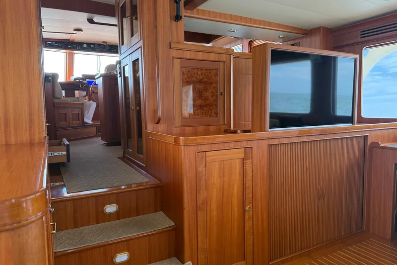 Slide: The Image of Luxurious wooden interior of 2011 Marlow Explorer 70E yacht with ocean view. - 3