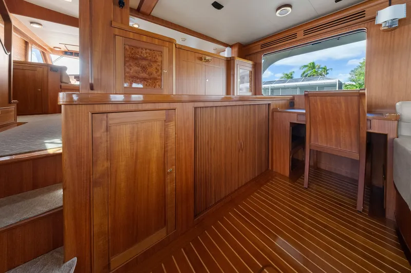 Slide: The Image of Luxurious wooden interior of a 2011 Marlow Explorer 70E yacht with elegant cabinetry. - 30
