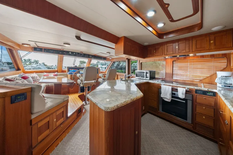 Slide: The Image of Luxurious interior of 2011 Marlow Explorer 70E yacht with modern kitchen and seating area. - 23