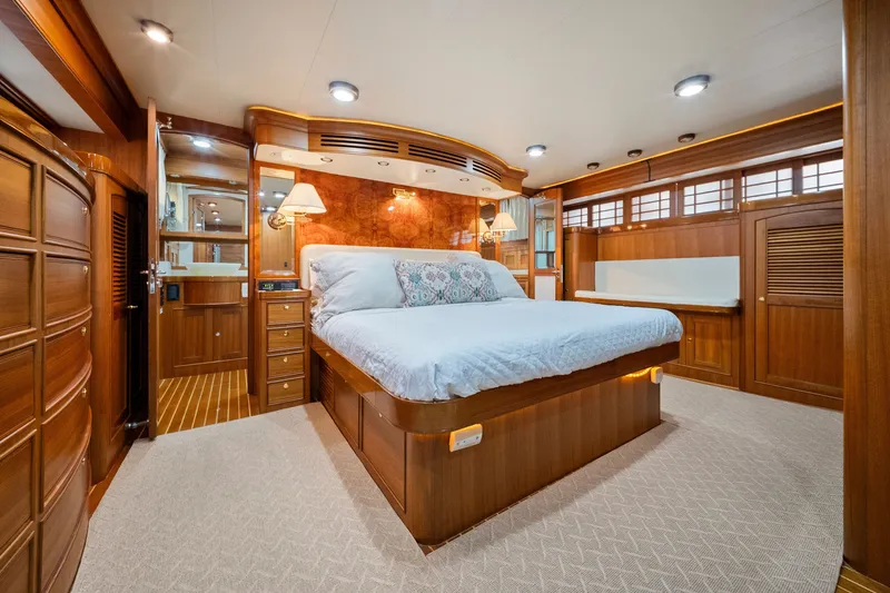 Slide: The Image of Luxurious bedroom interior of 2011 Marlow Explorer 70E yacht with elegant wood finishes. - 31