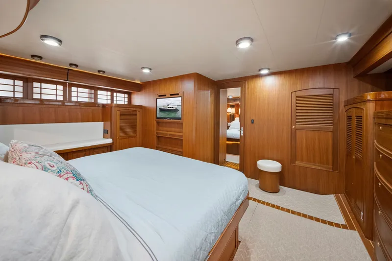 Slide: The Image of Luxurious cabin interior of 2011 Marlow Explorer 70E yacht with wood paneling and modern amenities. - 32
