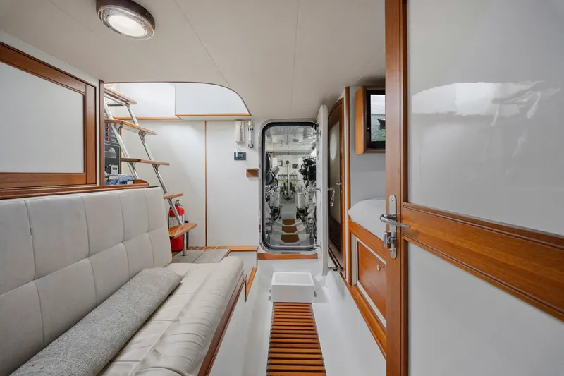 Slide: The Image of Interior of 2011 Marlow Explorer 70E yacht, featuring elegant wood finishes and modern design. - 46