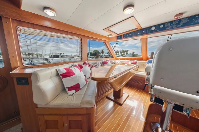 Slide: The Image of Luxurious interior of 2011 Marlow Explorer 70E yacht with plush seating and elegant wood finishes. - 21