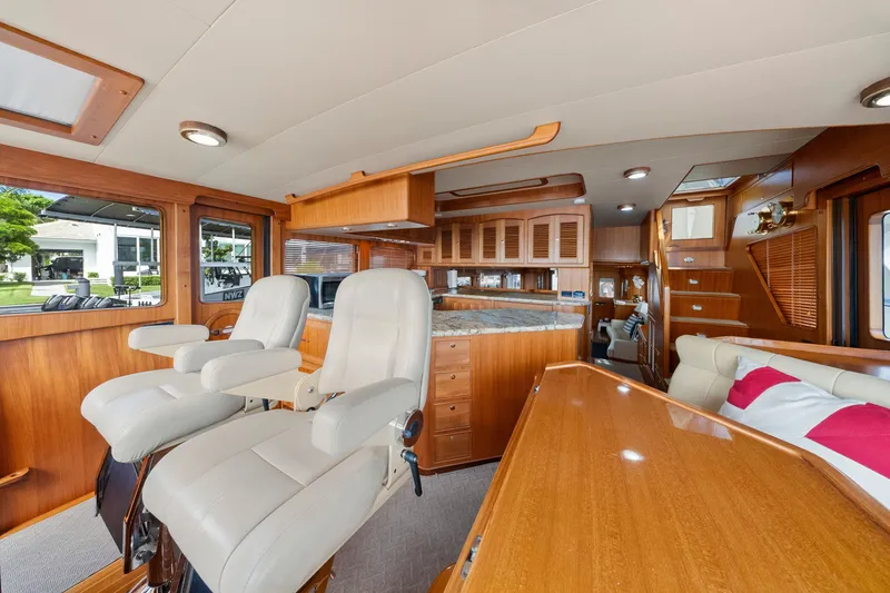 Slide: The Image of Luxurious interior of 2011 Marlow Explorer 70E yacht with plush seating and wooden finishes. - 22