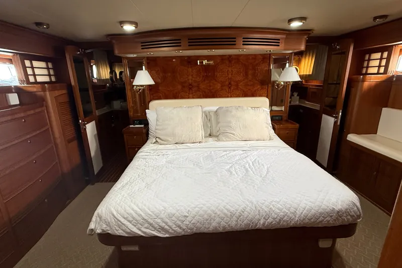Slide: The Image of Luxurious bedroom interior of 2011 Marlow Explorer 70E yacht with elegant wood finishes. - 4