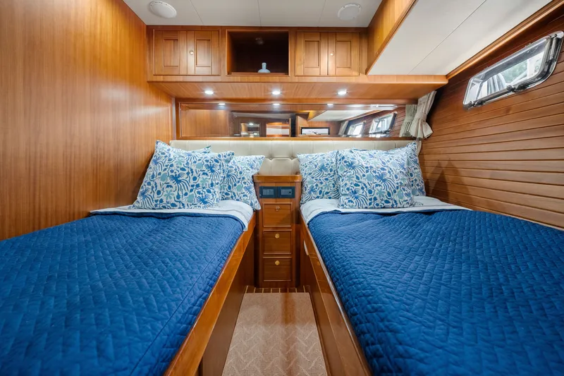 Slide: The Image of Luxurious twin cabin with blue bedding in 2011 Marlow Explorer 70E yacht. - 41