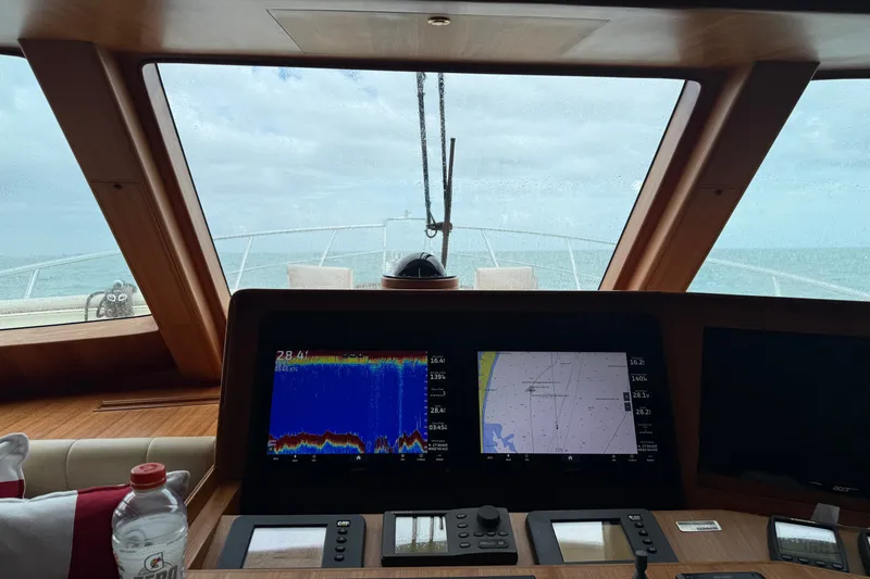 Slide: The Image of Bridge view of 2011 Marlow Explorer 70E yacht with navigation screens. - 7
