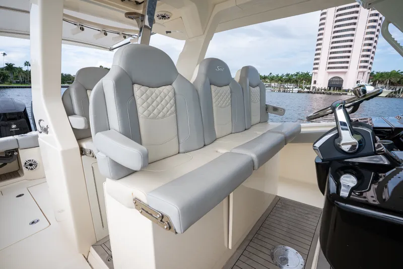 Slide: The Image of Luxury seating on 2022 Scout 425 LXF boat, featuring elegant design and waterfront view. - 23