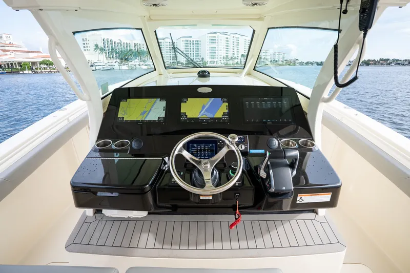 Slide: The Image of 2022 Scout 425 LXF boat helm with advanced navigation displays and controls. - 20