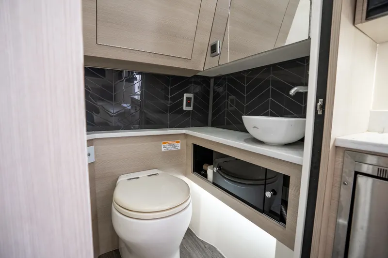 Slide: The Image of Modern bathroom in 2022 Scout 425 LXF boat with sleek fixtures and stylish design. - 34