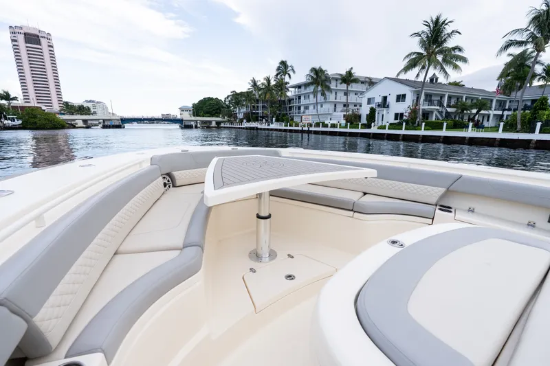 Slide: The Image of Luxurious 2022 Scout 425 LXF boat interior with waterfront view and modern seating. - 9