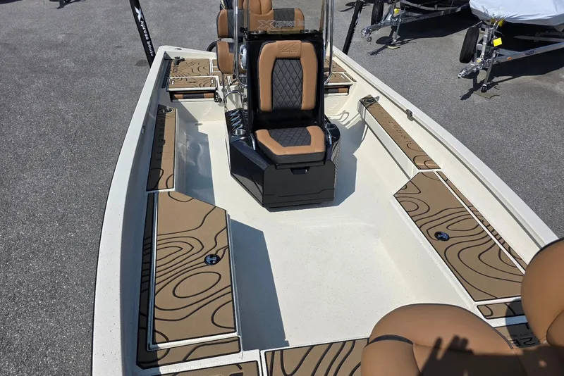 Slide: The Image of 2027 Xpress H22B Bay boat interior with stylish seating and deck design. - 8