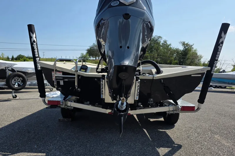 Slide: The Image of 2027 Xpress H22B Bay boat rear view with motor and trailer. - 4