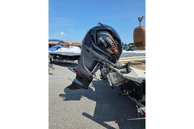 Slide: The Image of 2027 Xpress H22B Bay boat with Yamaha outboard motor, parked outdoors. - 3