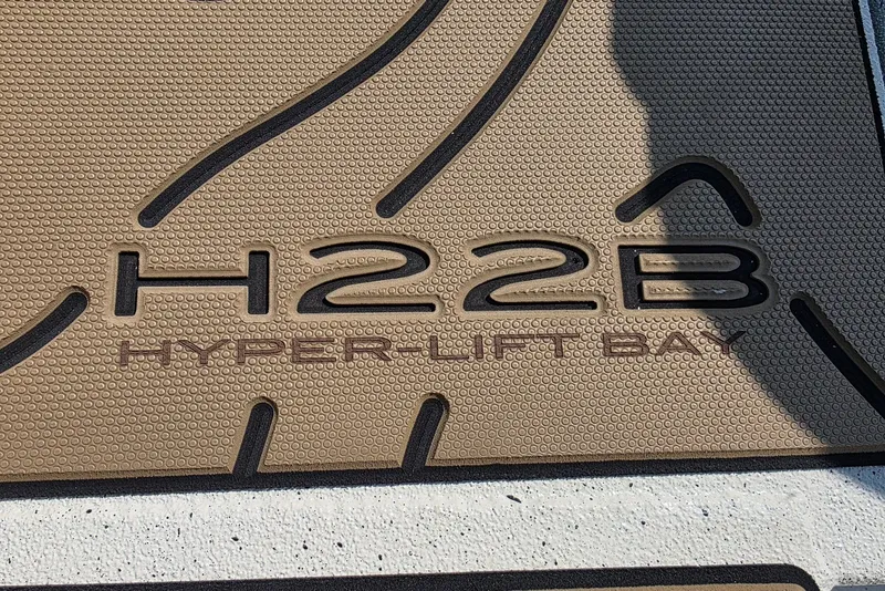 Slide: The Image of Xpress H22B Hyper-Lift Bay boat floor mat, 2027 model, textured design. - 7