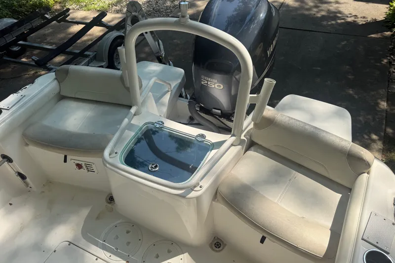 Slide: The Image of 2011 Everglades 230 Center Console boat interior with Yamaha 250 engine. - 11