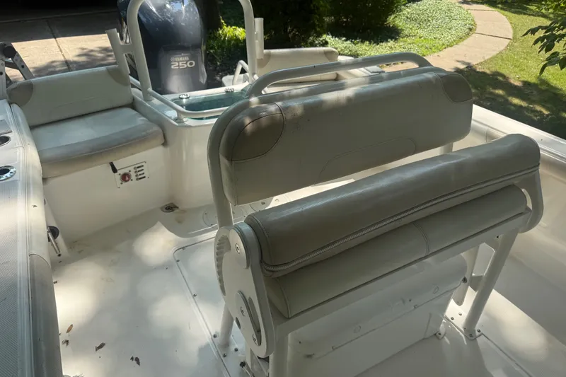 Slide: The Image of Interior of a 2011 Everglades 230 Center Console boat with seating and Yamaha 250 engine. - 8