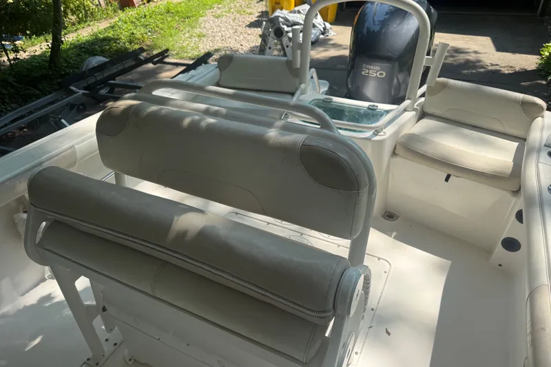Slide: The Image of 2011 Everglades 230 Center Console boat interior with seating and Yamaha 250 engine. - 9