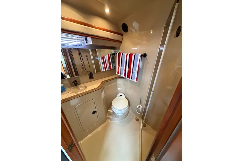 Slide: The Image of Bathroom interior of 2001 Cruisers Yachts 3870 Express with shower and sink. - 31