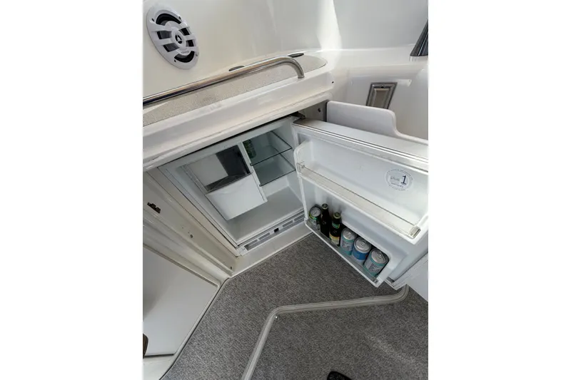 Slide: The Image of Mini fridge on 2001 Cruisers Yachts 3870 Express, stocked with beverages. - 9